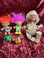 Full lot of 2 Troll dolls, 2 Pokemon figures, and 1 vintage cloth puppet