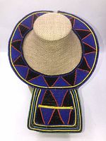 Full view of the beaded necklace displayed on beige bust showing the circular collar and the rectangular beaded panel.