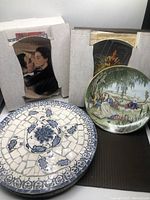 View of all items in lot showing three collector plates and one mosaic inlaid wall art piece.