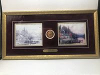 Full view of the framed Thomas Kinkade print including the two prints and center medallion.