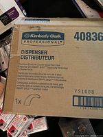 Boxed Kimberly-Clark Professional soap dispenser with SMART SHOT dispensing technology in original packaging