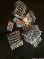 Multiple packs of no piercing needed tongue studs arranged showing bulk quantity, packaged in clear plastic with card backing.