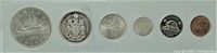 Top view of six 1966 Canadian coins in holder showing the obverse and reverse of each coin.