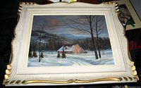 Framed oil painting showing complete artwork and frame front view in low light.