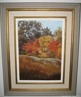 Framed oil painting titled 'Autumn' by Walter Goforth showing trees in fall colors, matting and frame visible.