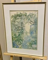 Frontal image of framed watercolor painting showing garden steps and gate.