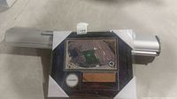 Notre Dame collector plaque with aerial stadium photo, Notre Dame logo, wooden bench piece from stadium, and a photo from the 2013 Notre Dame vs Oklahoma game, framed and displayed with certificate of authenticity