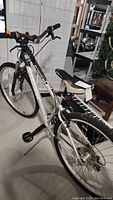 Full side view of Frontier mountain bike showing frame, seat, handlebars, and tires