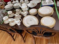 Table overview showing stacks of plates, cups and saucers.