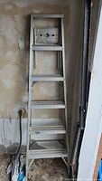 Front view of the aluminum step ladder showing all steps and general condition.