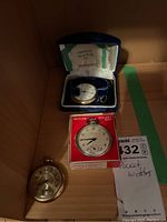 Three pocket watches including a Westclox Pocket Ben in box, Crown watch in a velvet lined box, and gold-tone watch
