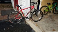 Front-left view of red Specialized Rockhopper mountain bike