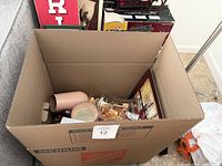 Box containing the lot items packed for sale.