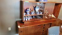 Front view of upper display cabinet sitting atop lower credenza showing overall appearance