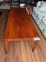 Top view of table showing wood grain surface and tapered legs