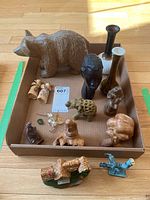 Overview of all decorative items including wood carvings, figurines, vases, and glass flower