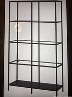 Official image of IKEA Vittsjö shelving unit showing metal frame with five glass shelves in dark brown/black color.