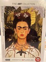 Frida Kahlo fine art puzzle box showing the self-portrait with thorn necklace and hummingbird 1000 pieces