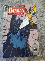Front cover of Batman #433 comic book in plastic sleeve, showing main cover art and title.