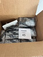 Box containing 14 individually wrapped metal elephant business card holders new in box.