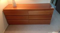 Full view of six-drawer dresser against wall, showing overall shape and condition