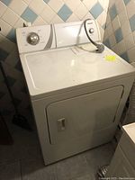 Full view of white Admiral electric clothes dryer with front door and control panel
