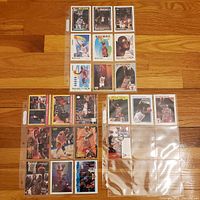 Front view of 22 Michael Jordan basketball cards arranged in plastic sleeves showing different brands and series from the 1990s.