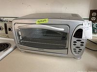 Front view of Europrox toaster oven with glass door, digital control panel, and size label 19x12x12.