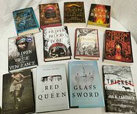 Top-down view of all 12 books showing cover art and condition.