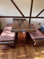 Front view of wooden table and two benches side by side
