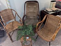 Group photo showing the three wicker chairs and small square wicker table with decorative greenery.