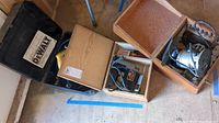DeWalt, Craftsman, and Black & Decker tools in cases and wooden boxes including cords and accessories