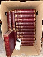 Top-down view of entire box showing all volumes in single stack plus two laid out