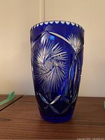 Front view showing pinwheel star-cut motif and scalloped rim