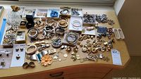 Wide view of jewelry assortment on wooden table