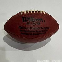 Photo of Wilson NFL official football showing logo, NFL trademark, and manufacturing information.