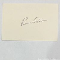 Photo shows a white 4x6 index card with a centered black ink signature of Richie Ashburn.
