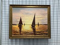Framed signed sailboat oil painting showing full artwork and frame details.