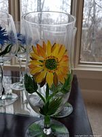Clear glass with large hand-painted yellow sunflower and green leaves on bowl and stem