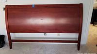 Wooden sleigh bed headboard front view