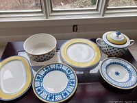Full display of various Villeroy & Boch Twist Anna china pieces: plate, platter, salad plate/bowl, two plates, serving bowl, tureen (lid removed).