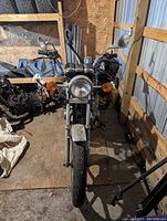 Front view of GS450 frame with headlight, forks, front wheel and turn signals