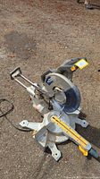 Front angle view of miter saw showing blade guard, base, and sliding mechanism