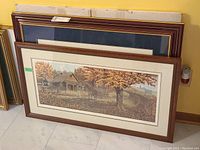 Four limited edition prints by James Lumbers, two framed and two unframed, stacked showing different frame styles and sizes.