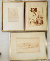 Three vintage framed drawings and engravings displayed on a wall, showing relative sizes and frame styles.