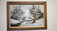 Framed signed original oil painting on canvas of snowy winter landscape with river and cabin, viewed head-on.
