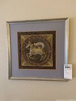 Frontal view of the framed embroidered Thai artwork featuring a horse with intricate beadwork and embroidery, matted and framed in silver with a light purple matte.