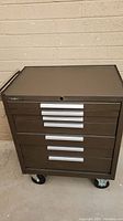 Full front view of Kennedy 297XB tool chest showing six drawers with silver handles and caster wheels at bottom.