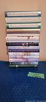 Stack of 15 books from the Christmas collection by Richard Paul Evans showing titles and condition.