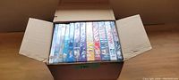 Box containing 12 sealed Grey's Anatomy DVD seasons.